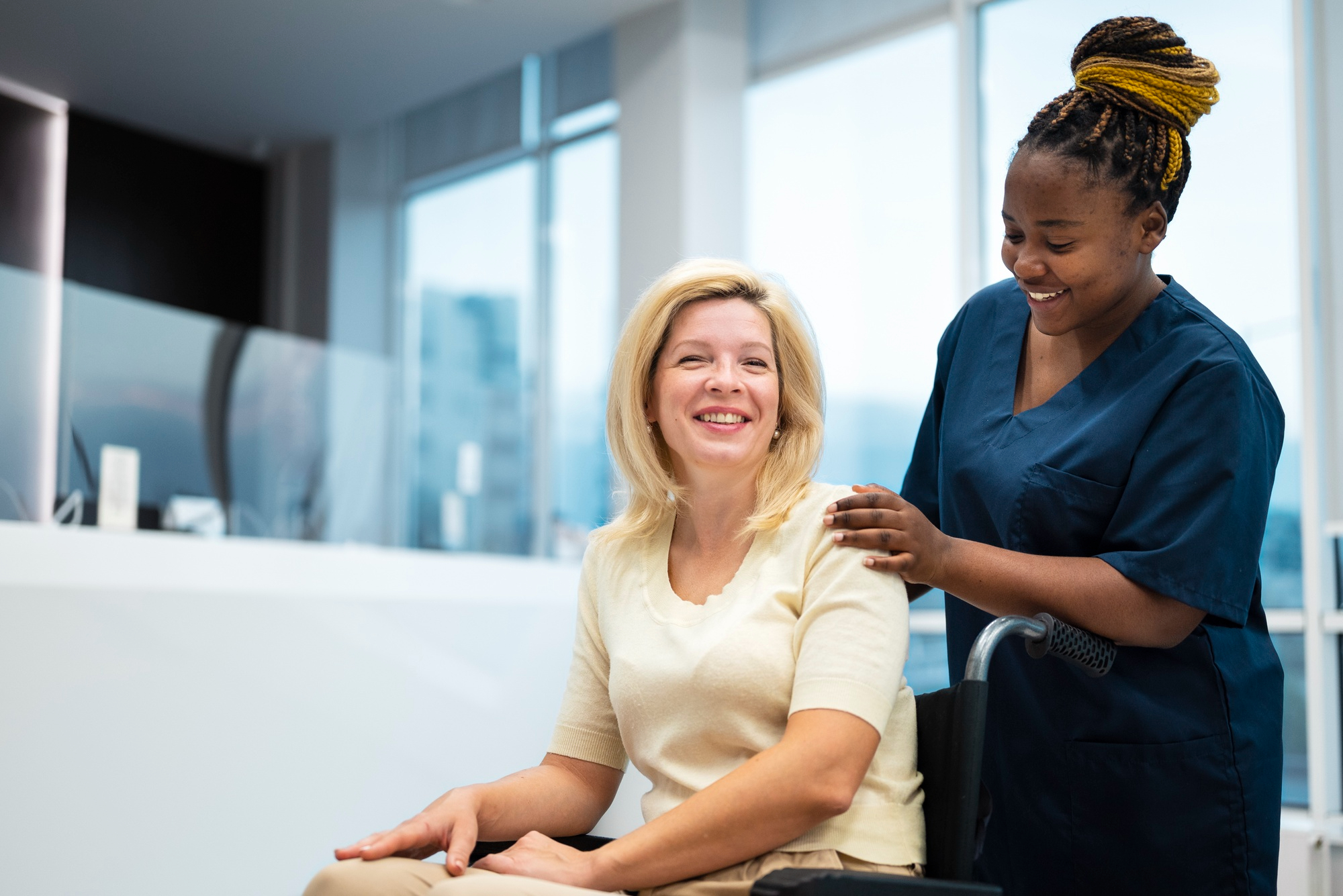 A woman stands in a classroom at a local organization.