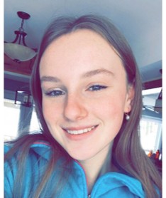 Headshot of Michaela.