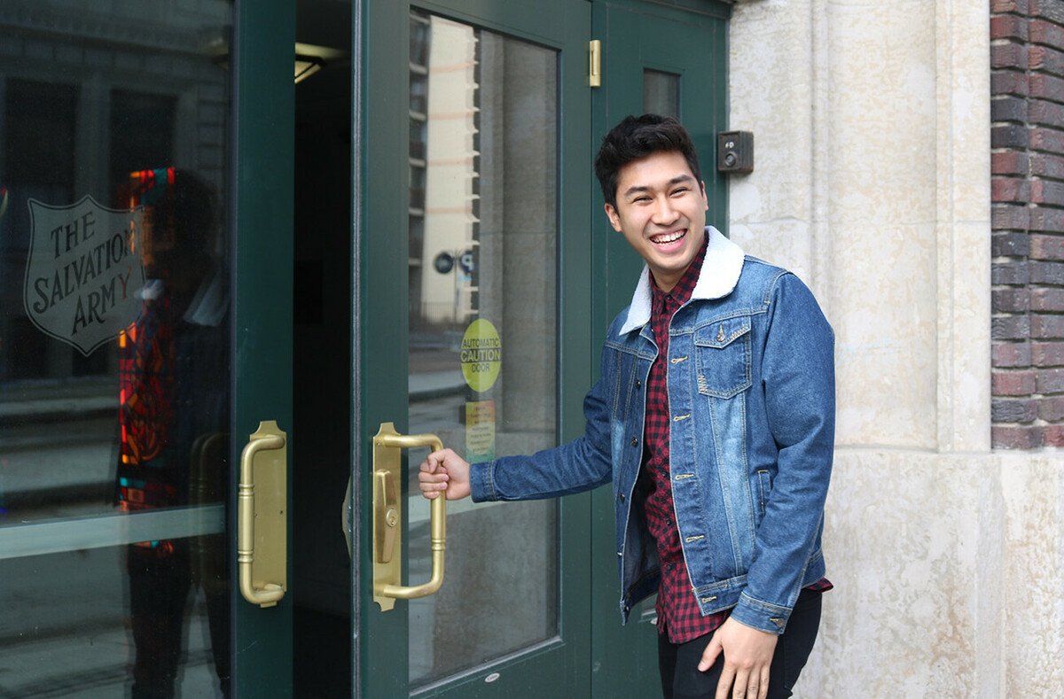 Josh at the front entrance of campus.